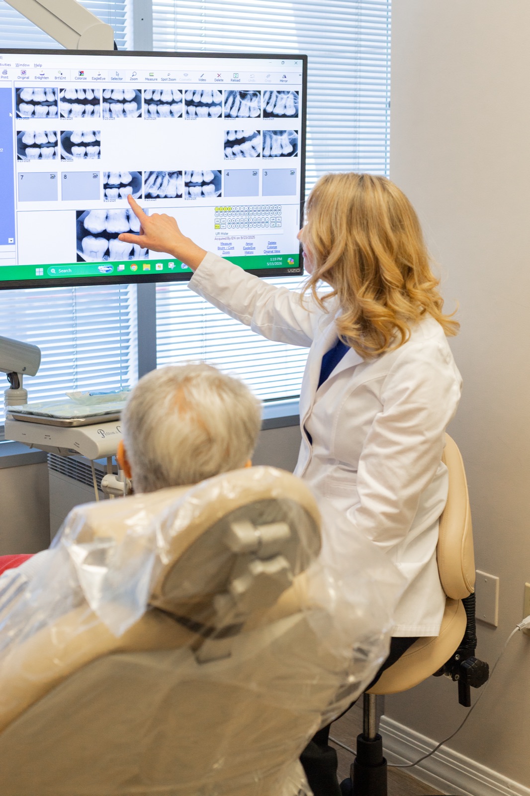 Dr. House reviewing diagnostic imaging with a patient