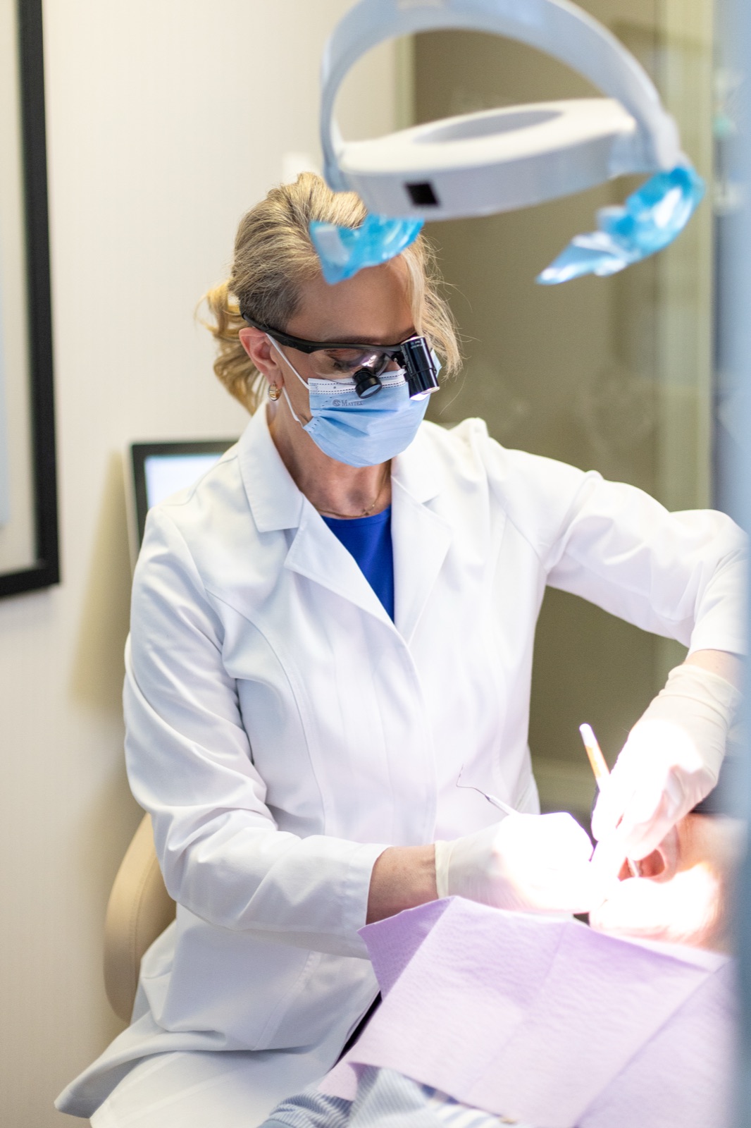 Dr. House performing a careful oral soft-tissue examination