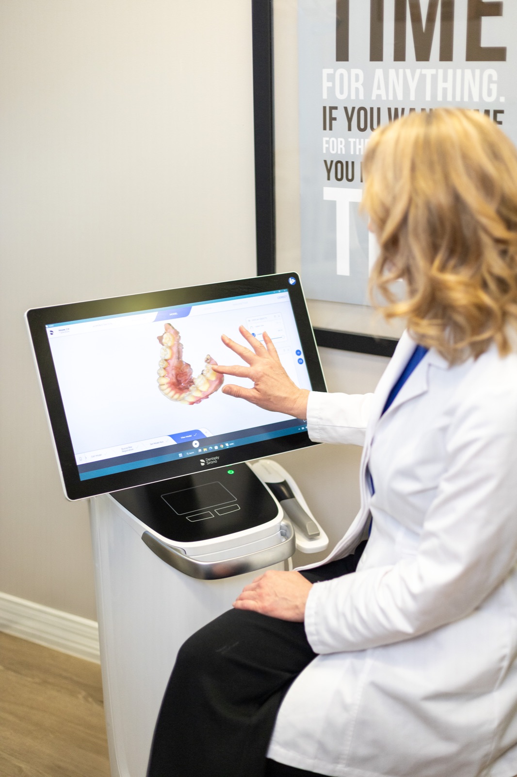 Dr. House reviewing an orthodontic treatment plan on a 3D scan