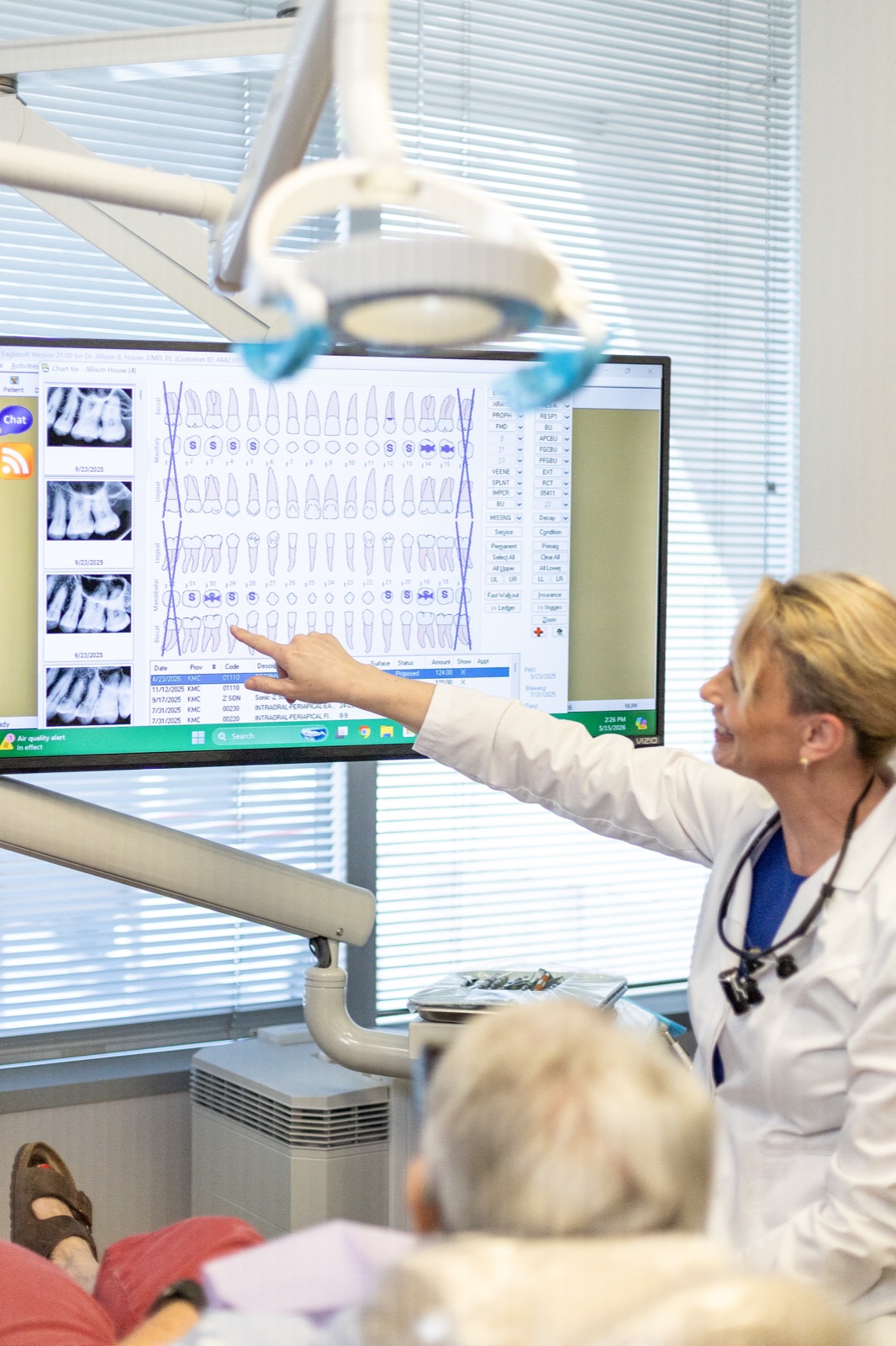 Dr. House reviewing a full-arch treatment plan with a patient